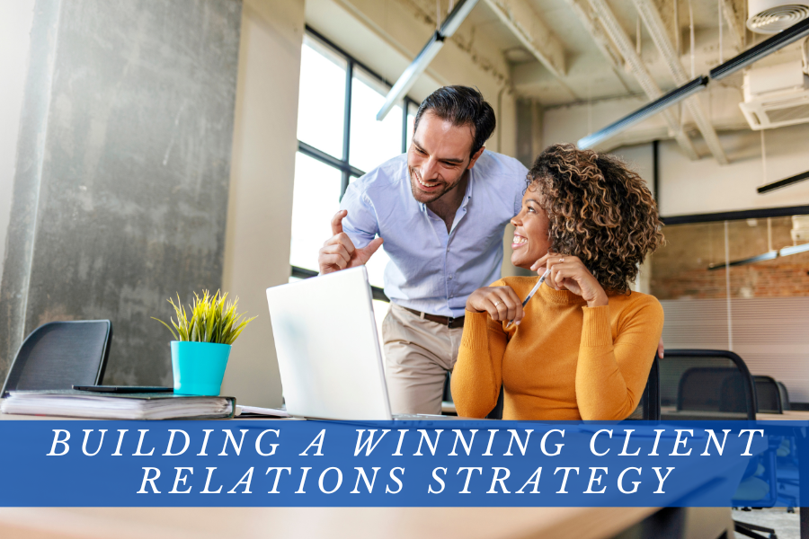 Two professionals discussing building a winning client relations strategy with proactive communication.